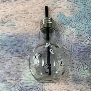 Light bulb , glass cup with straw